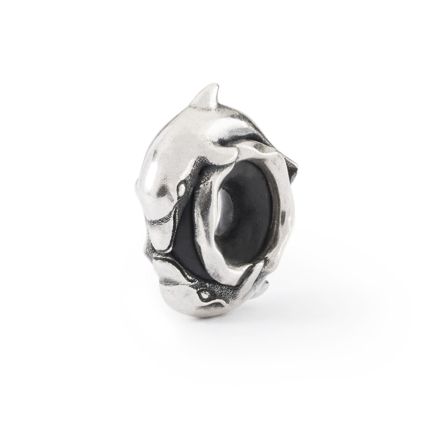 Two dolphins kiss on this silver jewellery bead