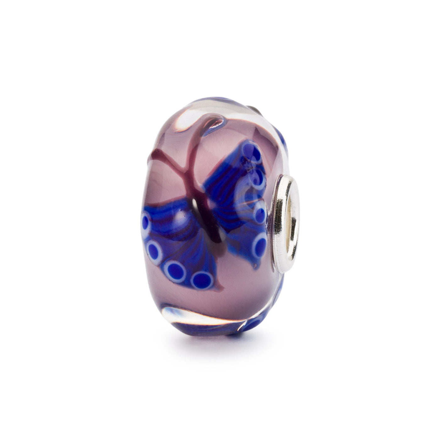 Jewellery bead in glass with blue butterflies on a light rose background 
