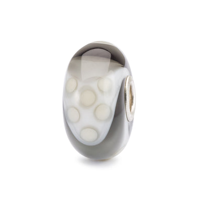 Glass bead in grey, beige and white in a armadillo shield pattern