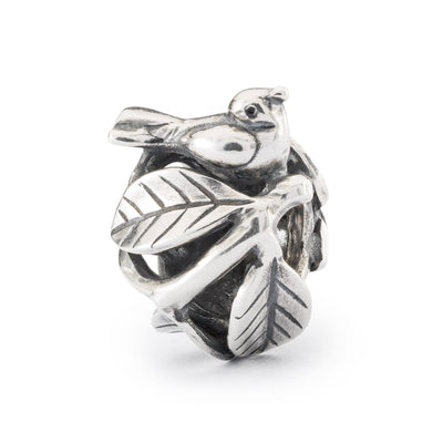 Birds Nest Bead featuring a intricate design of a nest with two birds sitting on top. The bead is made of sterling silver and has a round shape.